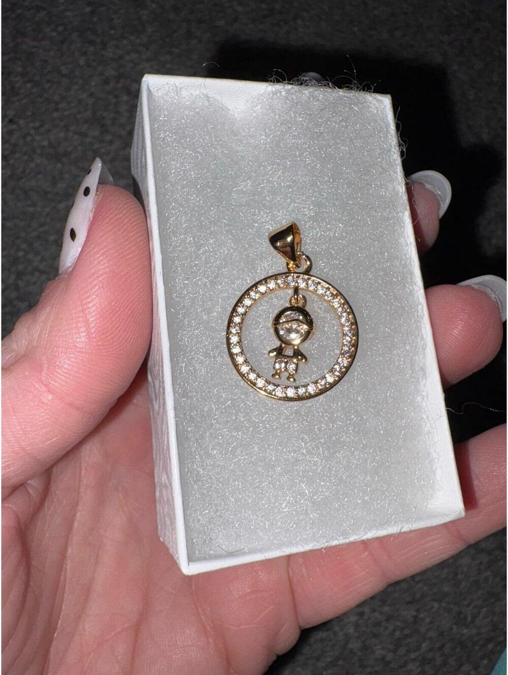 Gold plated over brass child pendant